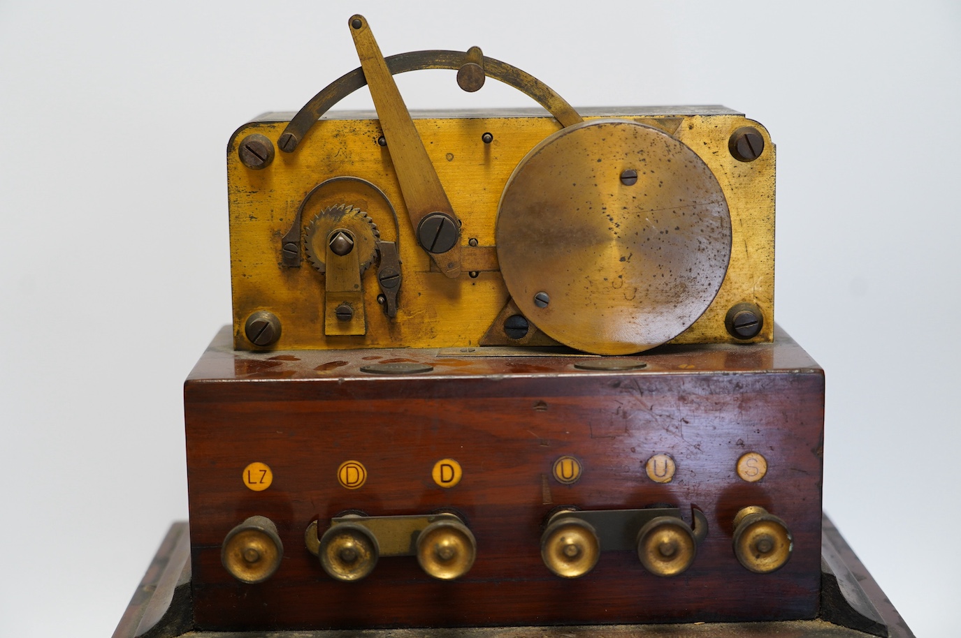 A late 19th century brass and mahogany Wheatstone type telegraph receiver (Morse inker), containing two drawers with paper rolls, 30cm high, 30cm wide, 28cm deep.